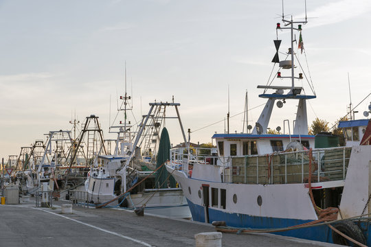 fishing boats in port canal in Rimini, Italy