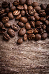 Coffee beans on grunge stone background