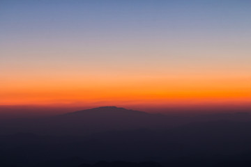 Layer of mountain and skyline after sunset