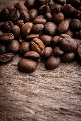 Coffee beans on grunge stone background