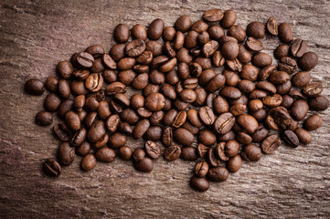 Coffee beans on grunge stone background