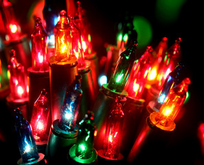 Fototapeta na wymiar Christmas, New Years garland colorful lights with bokeh dark background
