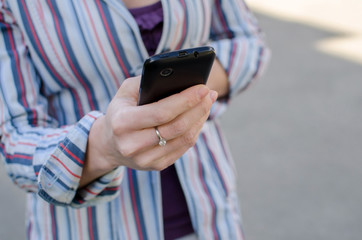 girl walking on the city with her phone