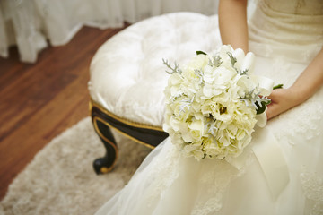 Bride holding flower bouquet