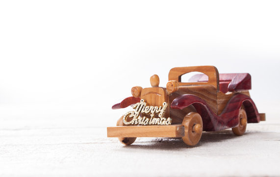 Retro wooden car with merry christmas sign,Christmas  card. Merr