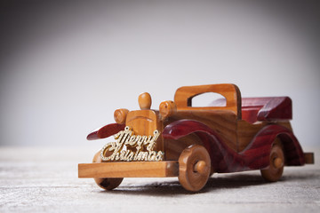 Retro wooden car with merry christmas sign,Christmas  card. Merr