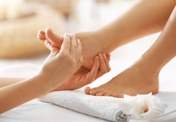 Obraz na płótnie Canvas Foot massage in spa salon, closeup