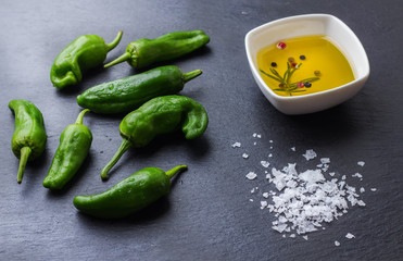 Raw green hot mexican peppers jalapeno pimientos padron spanish tapas