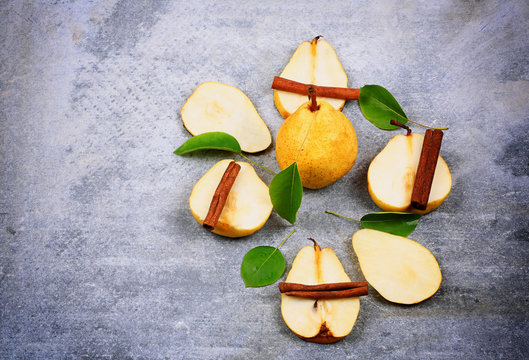pear and cinnamon on a stone background