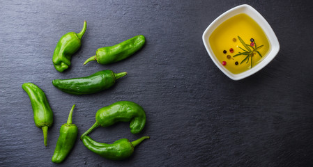 Raw green hot mexican peppers jalapeno pimientos padron spanish tapas