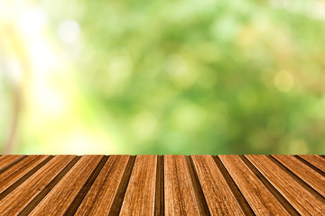 Naklejka na ściany i meble wood table on green nature background