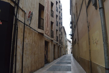 Narrow street between houses.