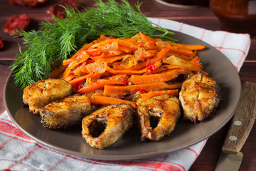 Fried fish with dill and carrot