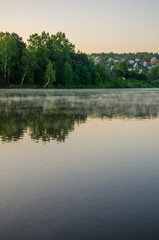 Fototapeta na wymiar fog over the water .