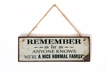 Board on a wall - Remember we are a normal family - Sarcastic funny thought on banner - inspiration hanging sign