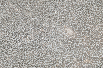 Closeup crack and peeling of old painted cement floor damaged by rain and sunlight textured background