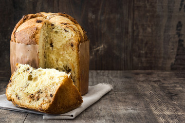 Christmas cake panettone on a rustic wooden background


