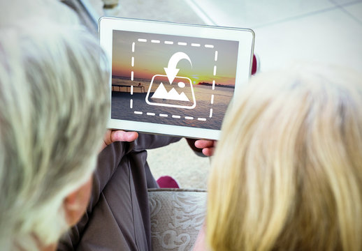 Two People Sharing a Tablet Mockup