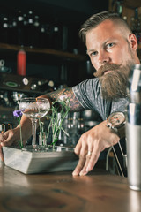 Barman is making cocktail