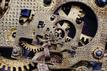 Collage of Bronze Clock Mechanism with cogwheels taken closeup.
