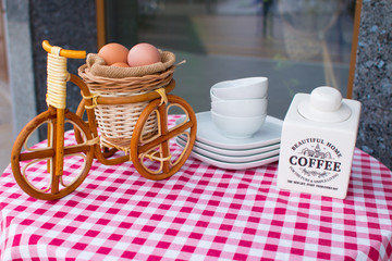 Outdoor breakfast. Coffee and eggs bike on the table in front of cafe