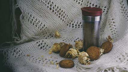 glass teapot with tea, Oatmeal Cookies, white knitted shawl