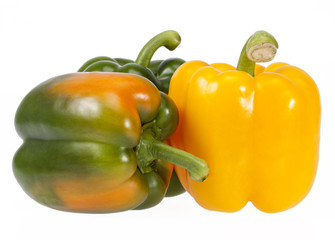 Vegetables of yellow and green peppers on white background