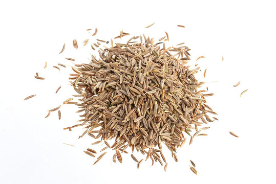 Pile of Cumin seeds isolated on white background