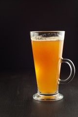 Healthy fresh apple juice drink on wooden background. Domestic production of apple juice for breakfast.
