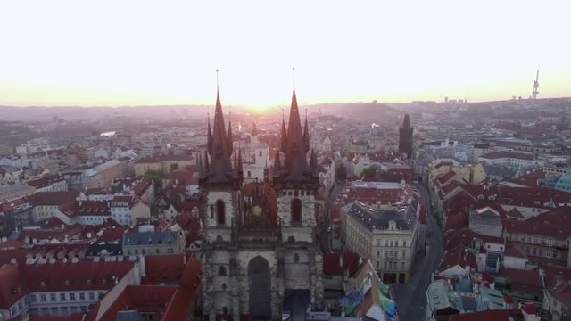 Flying over the Church of Our Lady before Tyn and Old Town of Prague at dawn. Czech Republic, Europe