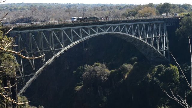 Truck and people crossing the victoria falls border bridge