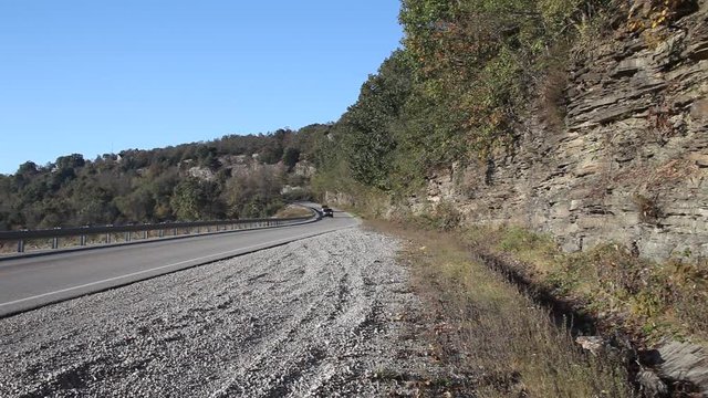 Highway in the Ouachita national forest with a truck driving.