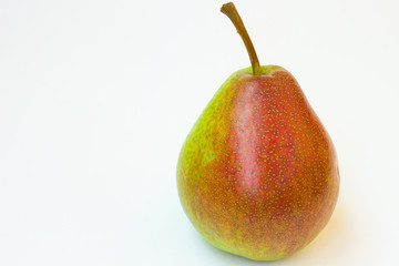 Ripe pear with sprig on a white background.