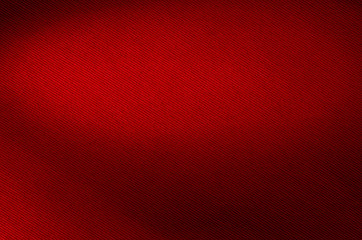 Red fabric background texture closeup.
