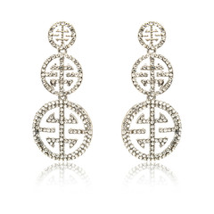 Fototapeta na wymiar Pair of silver diamond earrings isolated on white