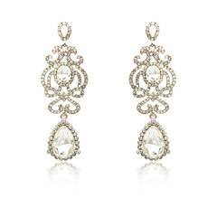 Pair of silver diamond earrings isolated on white