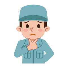 困惑する若い男性　作業着