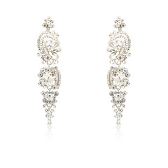 Pair of silver diamond earrings isolated on white