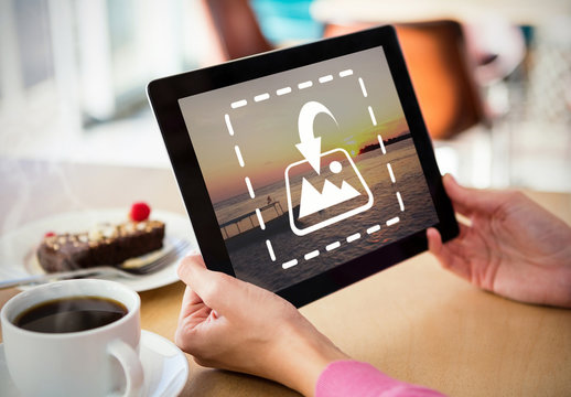 User with a Tablet in a Coffee Shop Mockup 1