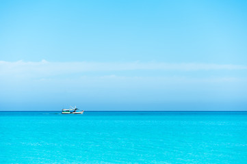 Boat sailing on blue Caribbean sea