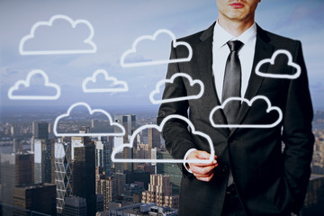 Businessman drawing cloud icons