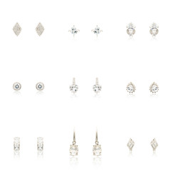 Fototapeta na wymiar Set Pair of silver diamond earrings isolated on white