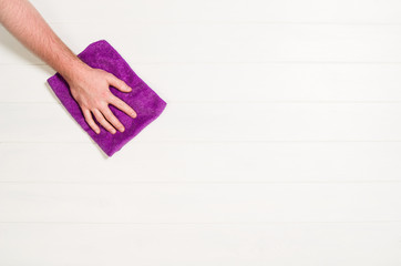 Hand cleaning against a white background