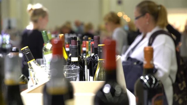 Many collectible bottles of wine on the counter.