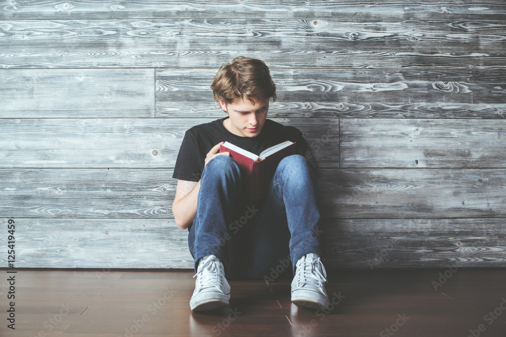 Wall mural guy reading book