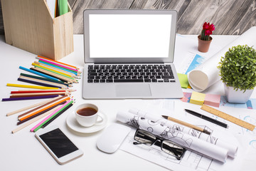 Office desk with white laptop