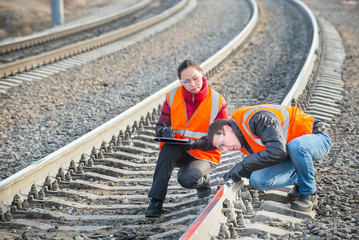 Railroad workers maintaing railways