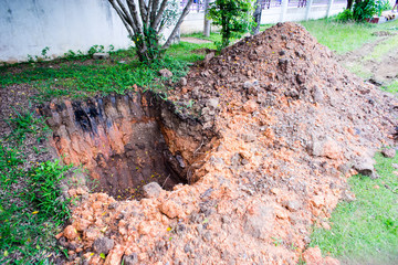 Earthworks, digging trench on ground