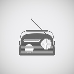 Vector icon of gray radio with antenna on the gradient background.
