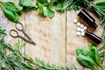 fresh summer herbs - aromatherapy at wooden background